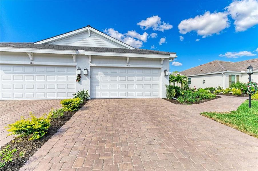 Front exterior of a new home in , Bradenton, FL, highlighting curb appeal (Image 21).