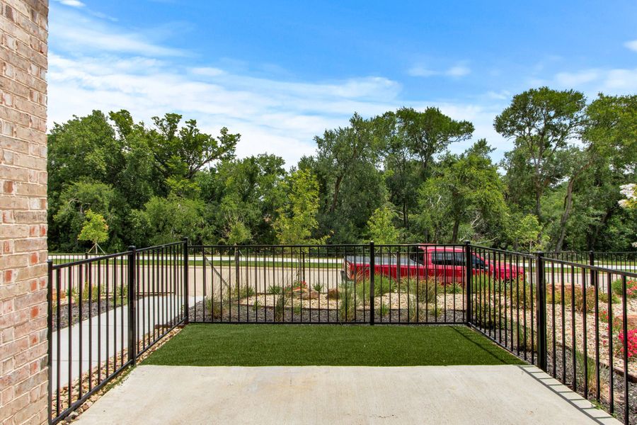 Exterior details and patio area of a home in Cottonwood Creek, Rowlett (Image 30).