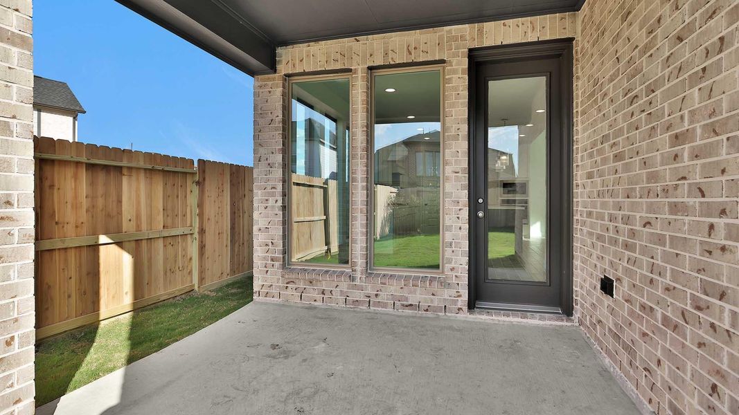 Exterior details and patio area of a home in Cross Creek West 45', Fulshear (Image 4). Exterior details and patio area of a home in Cross Creek West 45', Fulshear (Image 4).