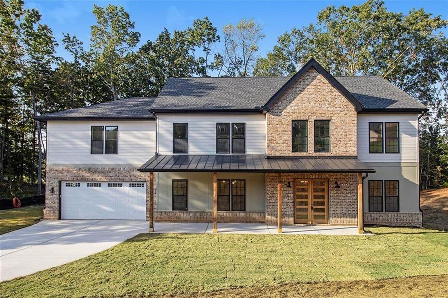 Front exterior of a new home in , Dawsonville, GA, highlighting curb appeal (Image 1). Front exterior of a new home in , Dawsonville, GA, highlighting curb appeal (Image 1).