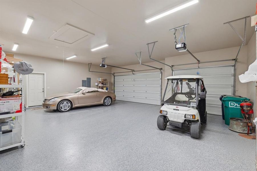 Spacious Extended 3-car Garage with Plenty of room for Storage and Durable Epoxy Flooring.