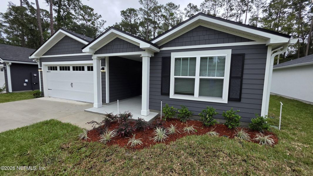 Front exterior of a new home in , Jacksonville, FL, highlighting curb appeal (Image 13).