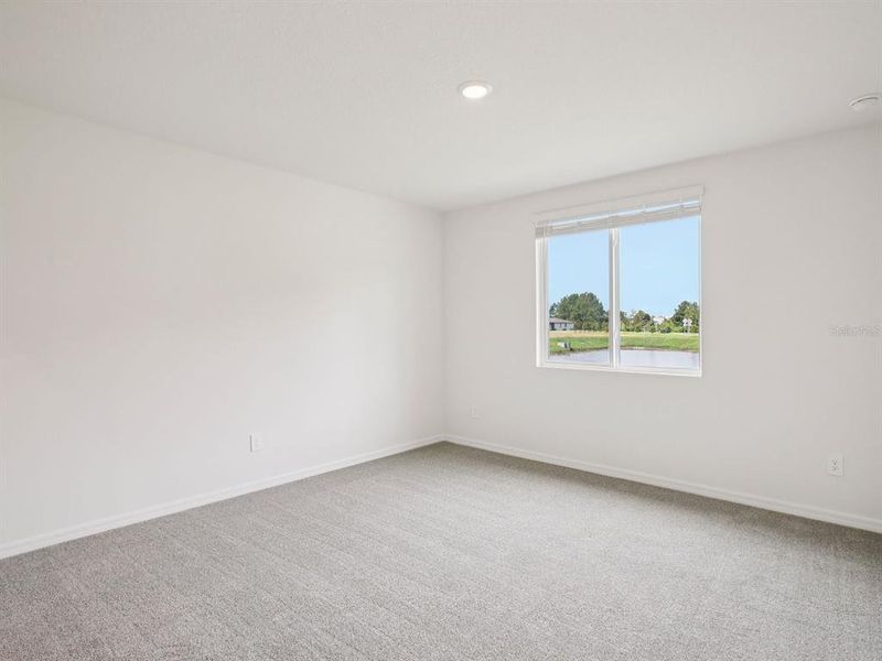 Spacious, unfurnished interior of a new home in The Grove at Stuart Crossing - Premier Series, Bartow (Image 20).