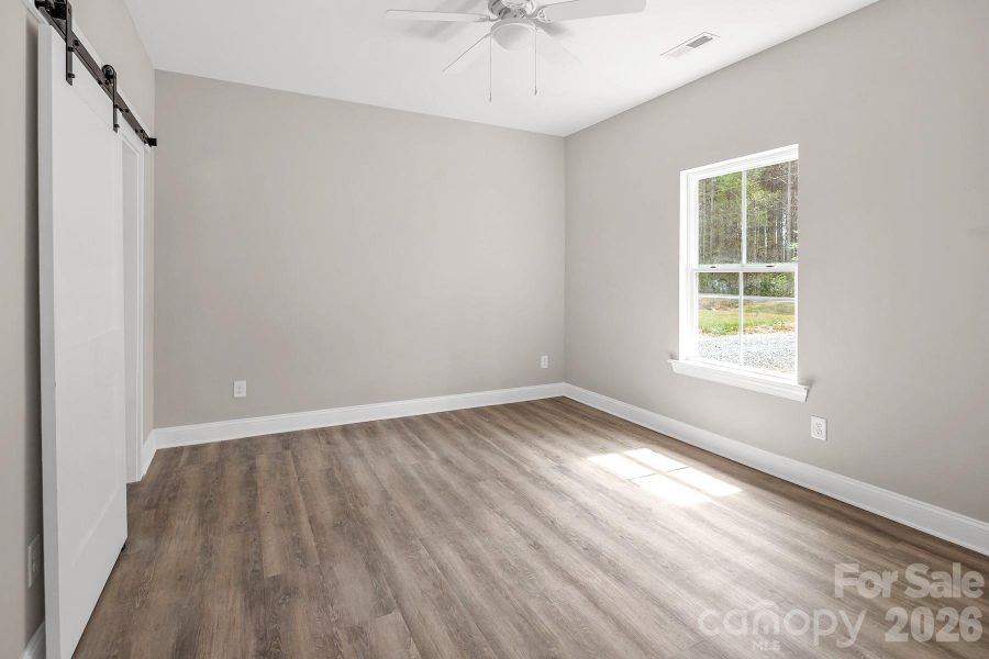 Primary Suite with walk in closet and en-suite bathroom.