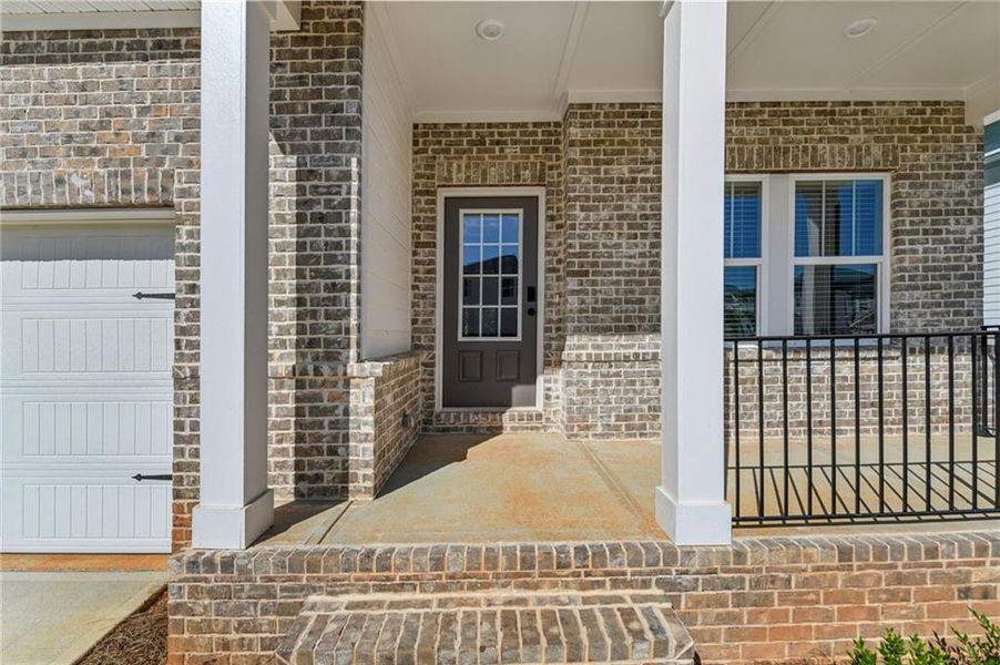 Front exterior of a new home in Martin Springs - Estate Series, Lawrenceville, GA, highlighting curb appeal (Image 1). Front exterior of a new home in Martin Springs - Estate Series, Lawrenceville, GA, highlighting curb appeal (Image 1).