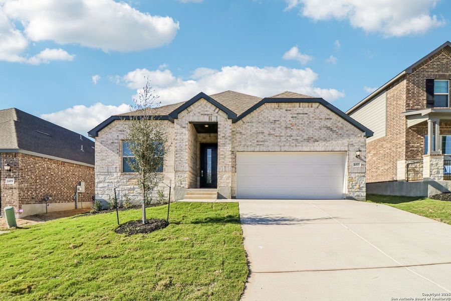 Front exterior of a new home in Arcadia Ridge - Classic Series, San Antonio, TX, highlighting curb appeal (Image 26).