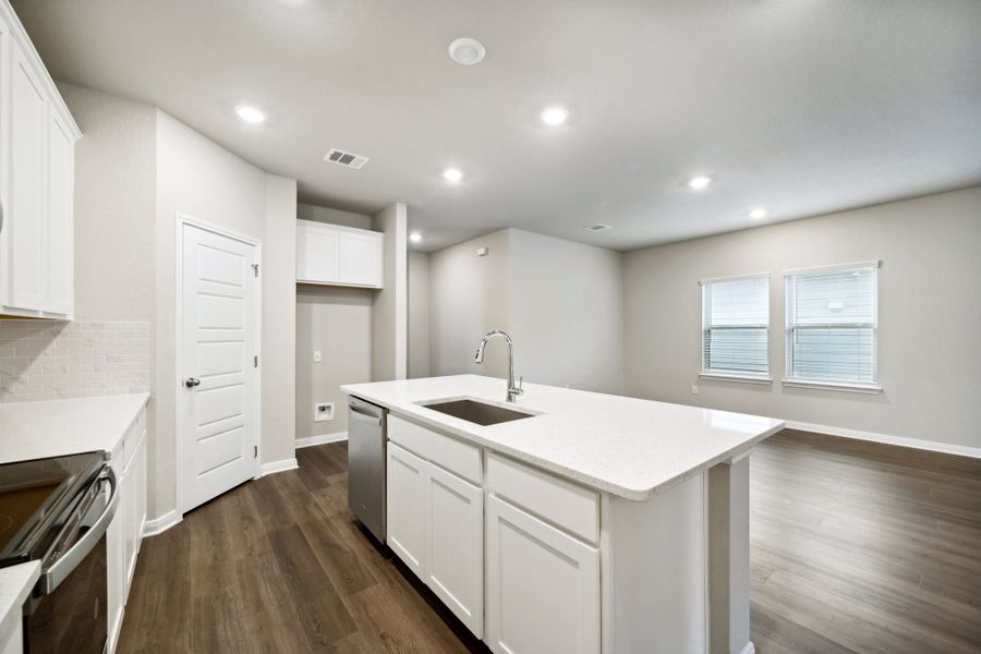 Kitchen in the Reynolds floorplan at a Meritage Homes community.