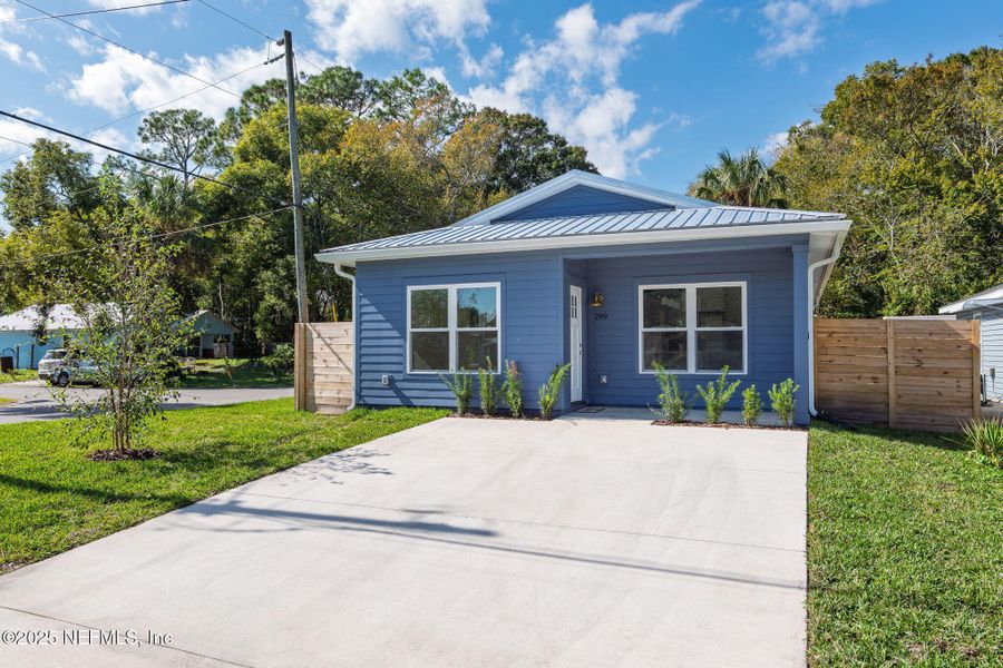 Front exterior of a new home in , St. Augustine, FL, highlighting curb appeal (Image 1).