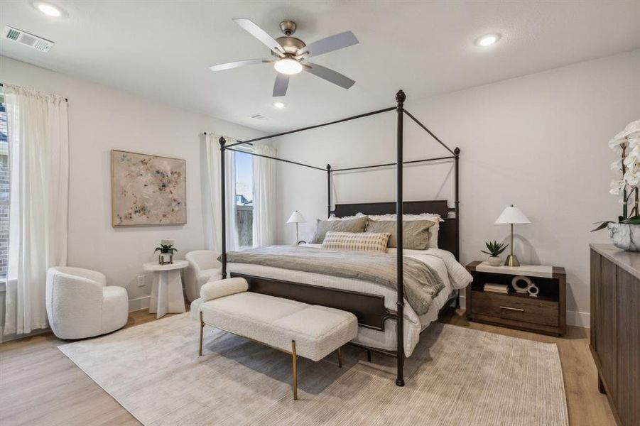 Bedroom with light wood-type flooring and ceiling fan