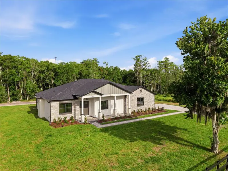 Front exterior of a new home in , St. Cloud, FL, highlighting curb appeal (Image 30).