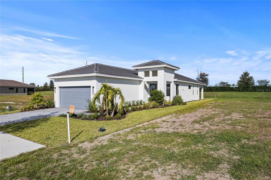 Front exterior of a new home in Cresswind Lakewood Ranch, Lakewood Ranch, FL, highlighting curb appeal (Image 2). Front exterior of a new home in Cresswind Lakewood Ranch, Lakewood Ranch, FL, highlighting curb appeal (Image 2).
