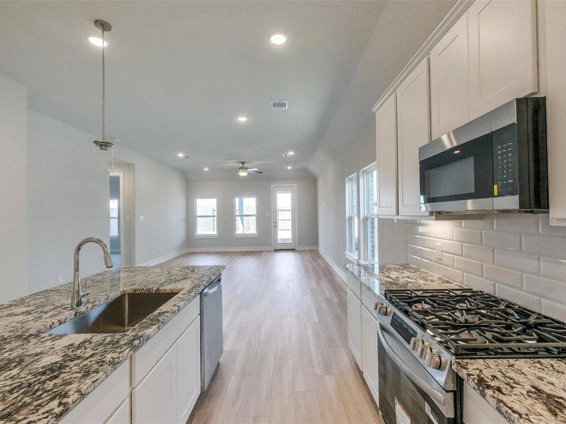 Furnished interior view inside a new home in Sunterra, Katy (Image 9).