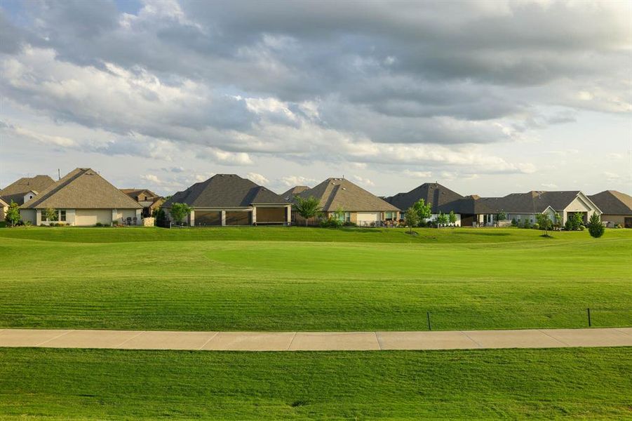Front exterior of a new home in Robson Ranch Texas, Denton, TX, highlighting curb appeal (Image 19). Front exterior of a new home in Robson Ranch Texas, Denton, TX, highlighting curb appeal (Image 19).