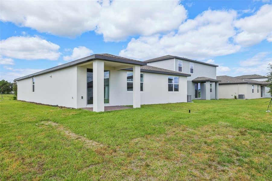 Exterior details and patio area of a home in The Reserve at Twin Lakes, St. Cloud (Image 20).