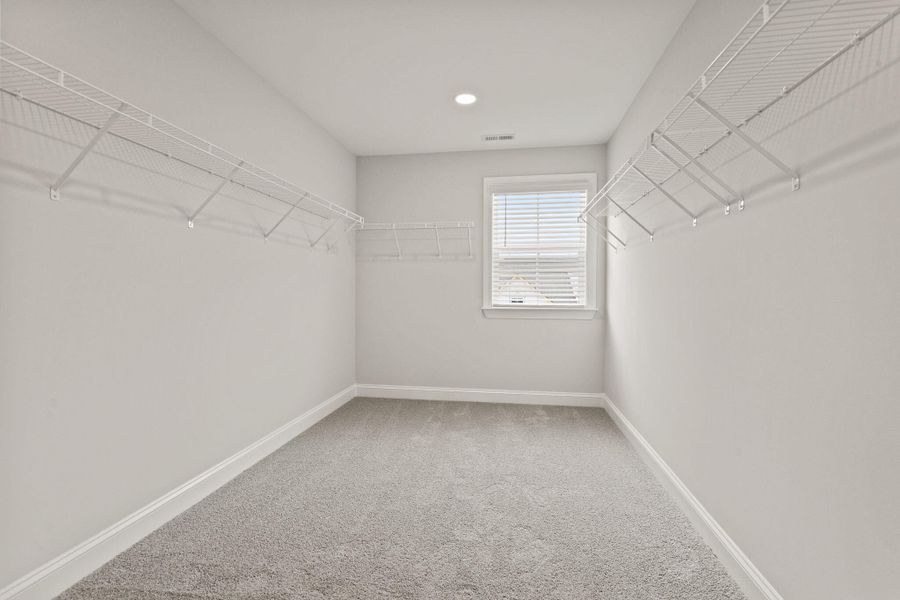 Spacious, unfurnished interior of a new home in Tidewater at Lakes of Cane Bay, Summerville (Image 18).
