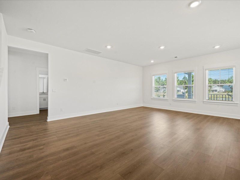 Spacious, unfurnished interior of a new home in The Coves at Lakes of Cane Bay, Summerville (Image 14).
