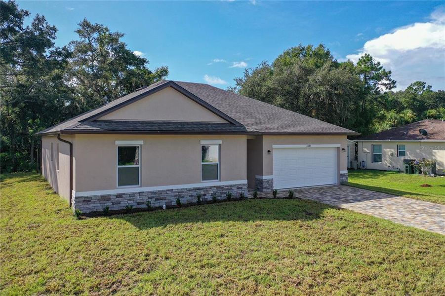 Front exterior of a new home in , Port Charlotte, FL, highlighting curb appeal (Image 2).