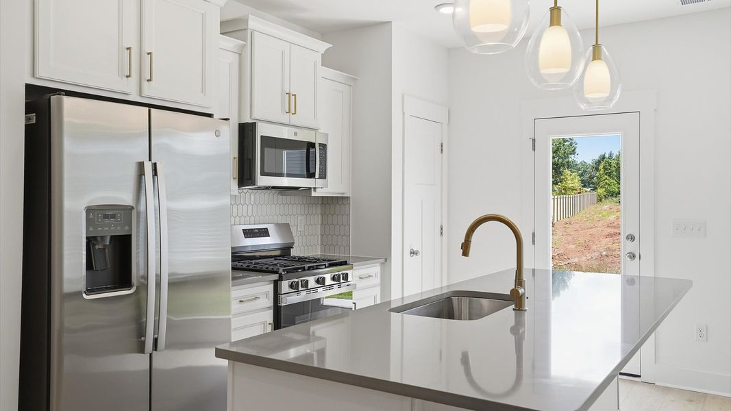 Beautifully appointed kitchen with spacious counters and sophisticated detailing in Fountain Inn, SC Beautifully appointed kitchen with spacious counters and sophisticated detailing in Fountain Inn, SC