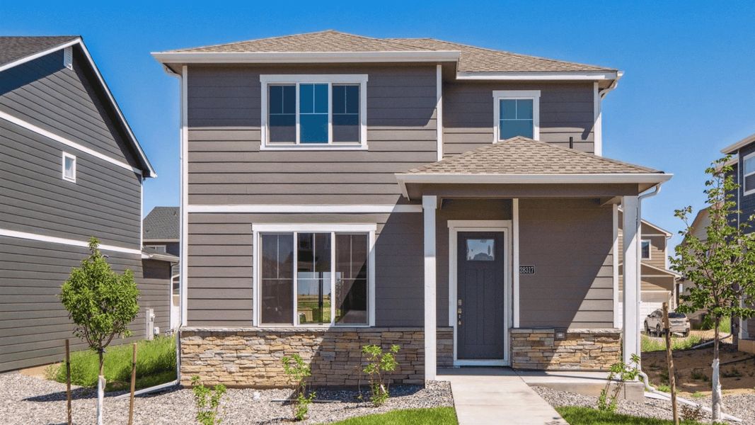 Front exterior of a home in the Sky Ranch community, located in Watkins, CO (Image 23).
