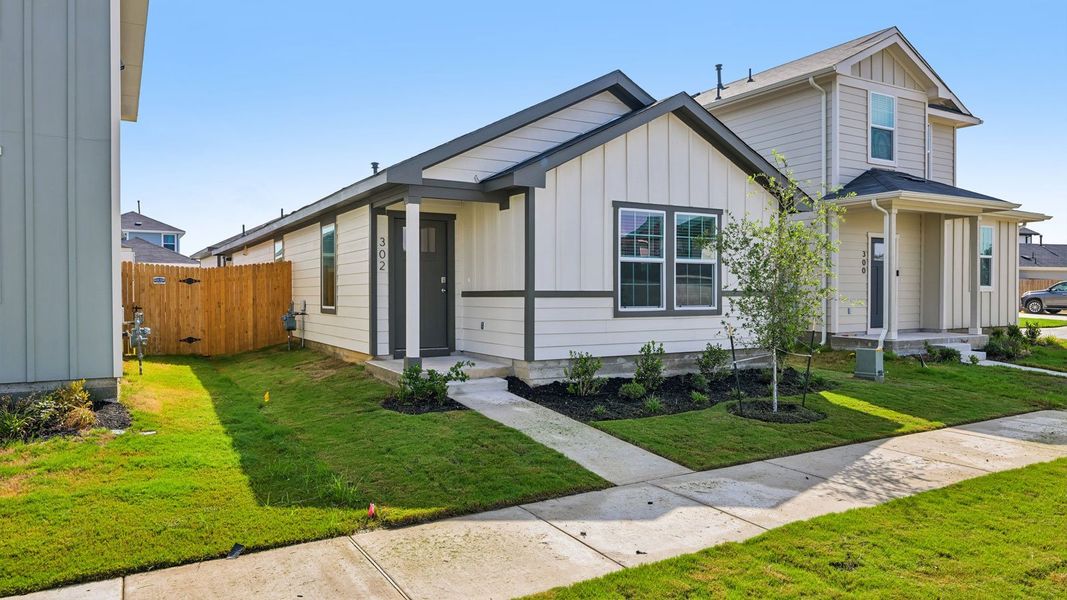 Front exterior of a new home in Valverde, Bastrop, TX, highlighting curb appeal (Image 17).