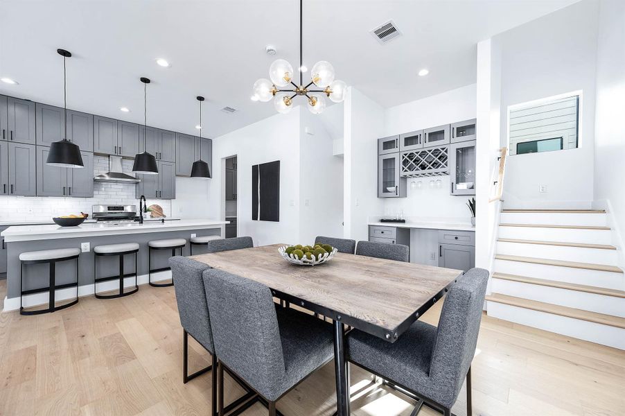 View from the balcony door, this shows you the dining, kitchen, and the amazing inset dry bar that has been inlcuded for entertaining. View from the balcony door, this shows you the dining, kitchen, and the amazing inset dry bar that has been inlcuded for entertaining.