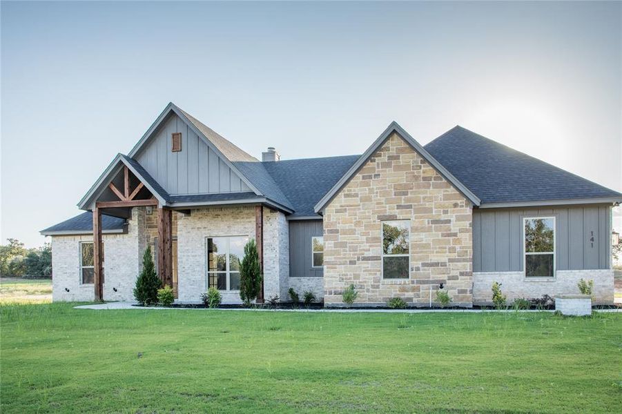 Front exterior of a new home in , Poolville, TX, highlighting curb appeal (Image 14).