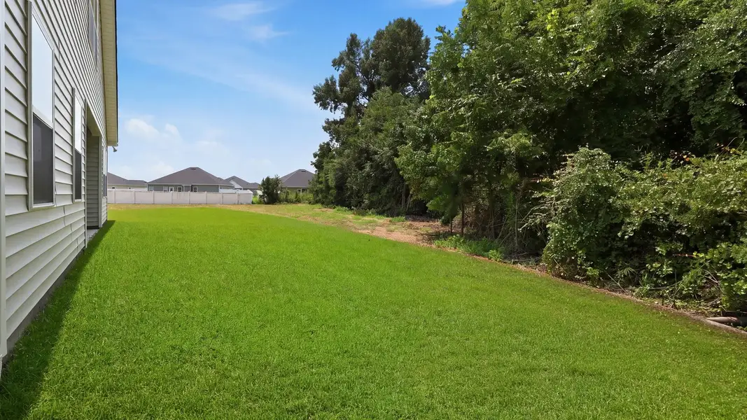 Exterior details and patio area of a home in Villa Grande, Winterville (Image 22).