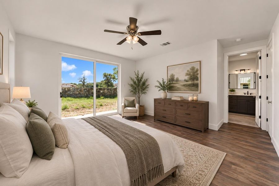 Virtually staged primary Bedroom; Sliding glass doors open directly to the outdoor yard from this primary bedroom suite.