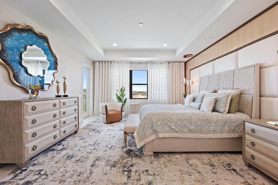 Coffered ceilings, full decorative wall, upgraded wood flooring, and access to the covered verandah.