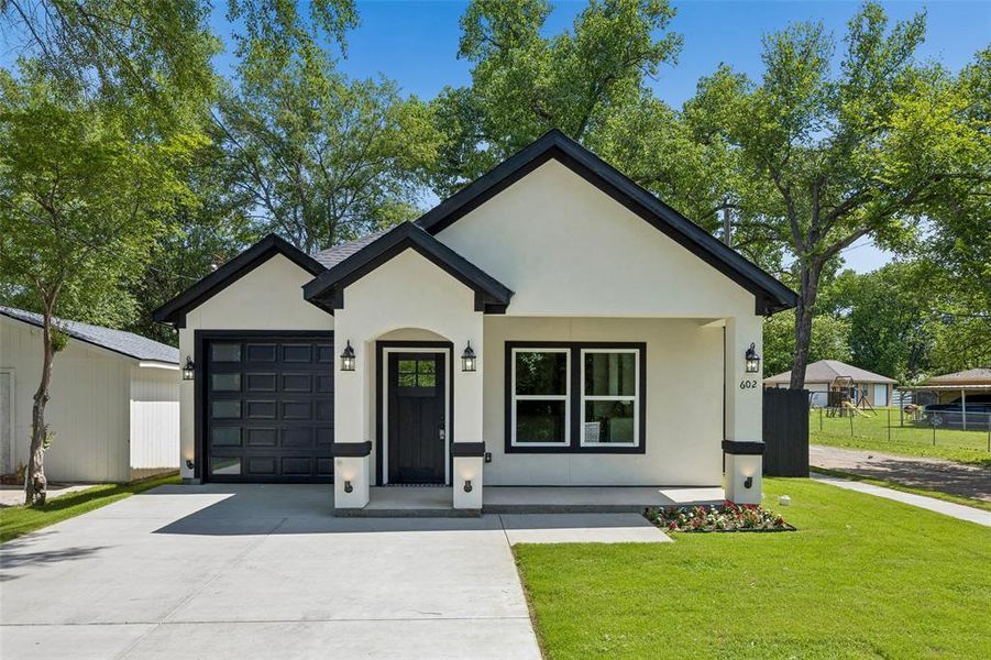Front exterior of a new home in , Terrell, TX, highlighting curb appeal (Image 1). Front exterior of a new home in , Terrell, TX, highlighting curb appeal (Image 1).