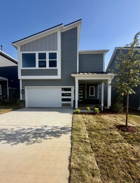 Front exterior of a new home in Nexus – Park Collection, Gallatin, TN, highlighting curb appeal (Image 1). Front exterior of a new home in Nexus – Park Collection, Gallatin, TN, highlighting curb appeal (Image 1).