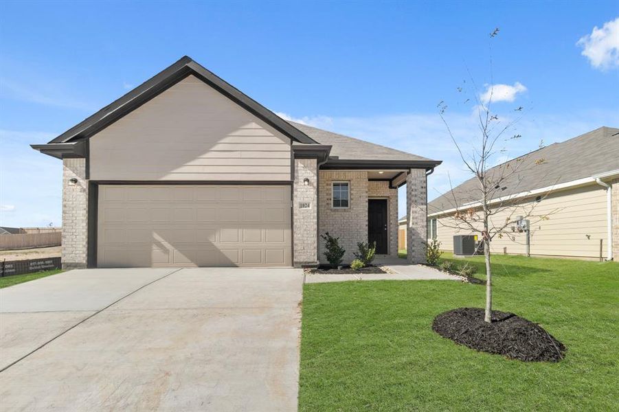Front exterior of a new home in Retreat at Fossil Creek, Fort Worth, TX, highlighting curb appeal (Image 2). Front exterior of a new home in Retreat at Fossil Creek, Fort Worth, TX, highlighting curb appeal (Image 2).