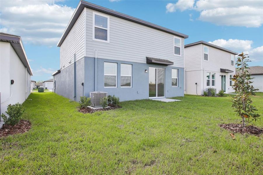 Front exterior of a new home in Benton Hills - Premier Series, Brooksville, FL, highlighting curb appeal (Image 18). Front exterior of a new home in Benton Hills - Premier Series, Brooksville, FL, highlighting curb appeal (Image 18).