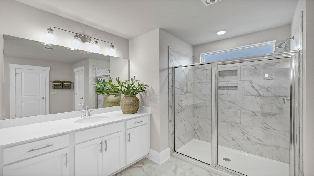 Representative furnished interior of a home built from the Harbor Oak by D.R. Horton in Lake Tide Summit, Chapin (Image 43).