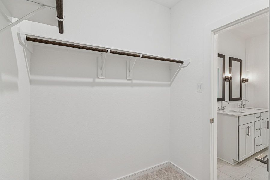 Walk-in closet in the primary suite Walk-in closet in the primary suite