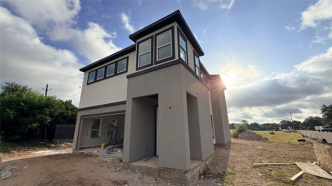 A newly constructed modern home awaits its finishing touches, offering contemporary design and a blank canvas for personalization.