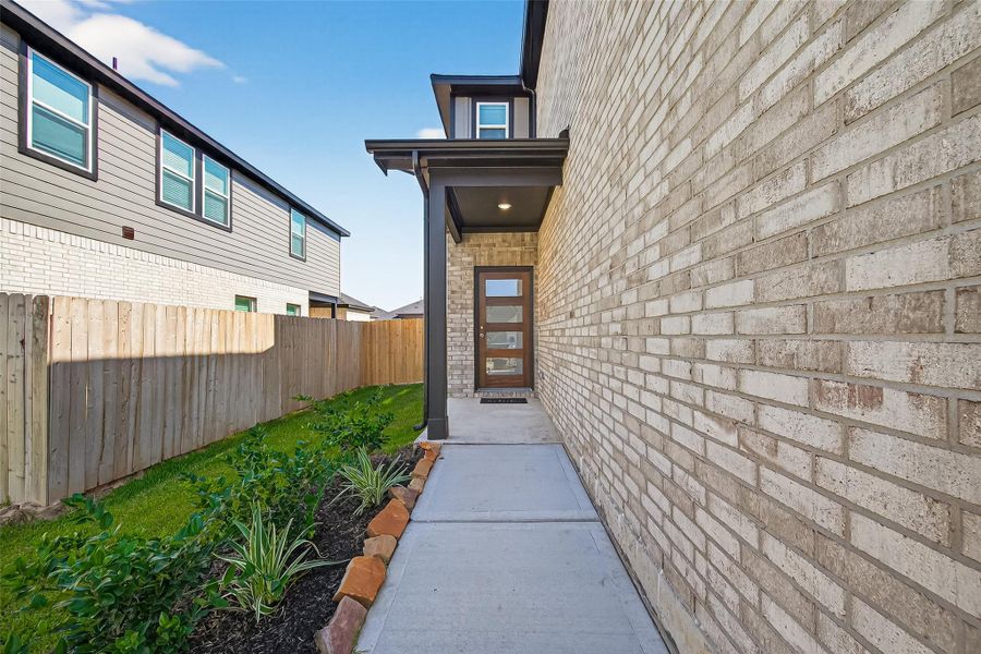 Exterior details and patio area of a home in Mill Creek Trails, Magnolia (Image 3).