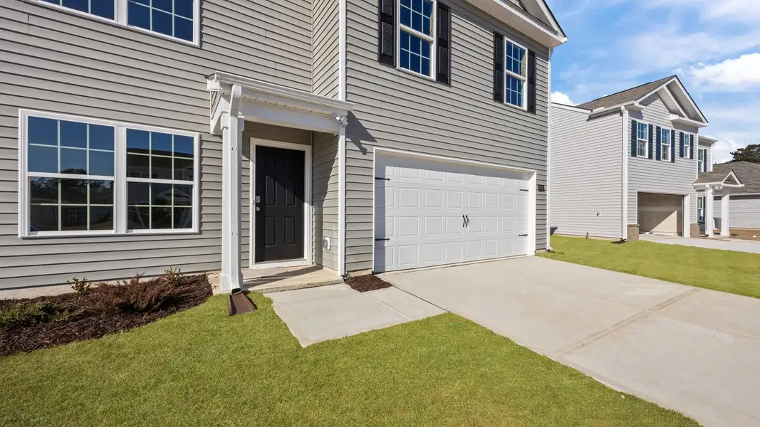 Exterior details and patio area of a home in Madeline Farm, New Bern (Image 3).