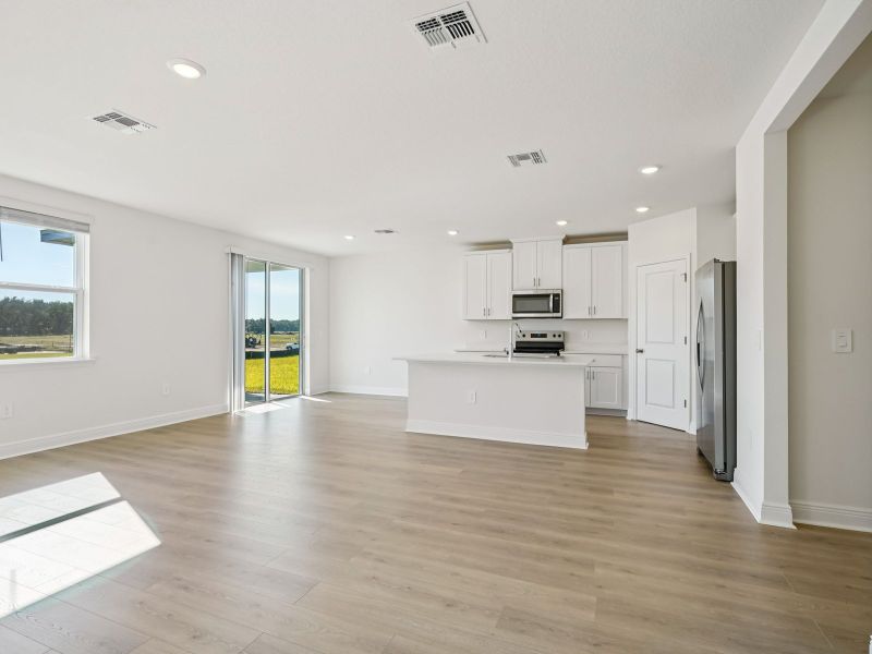 Spacious, unfurnished interior of a new home in The Reserve at Hammock Oaks - Signature Series, Lady Lake (Image 11).