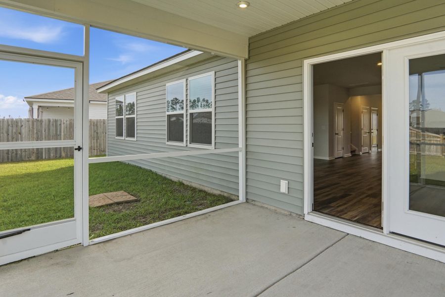 Exterior details and patio area of a home in Sanctuary Cove at Cane Bay, Summerville (Image 25).