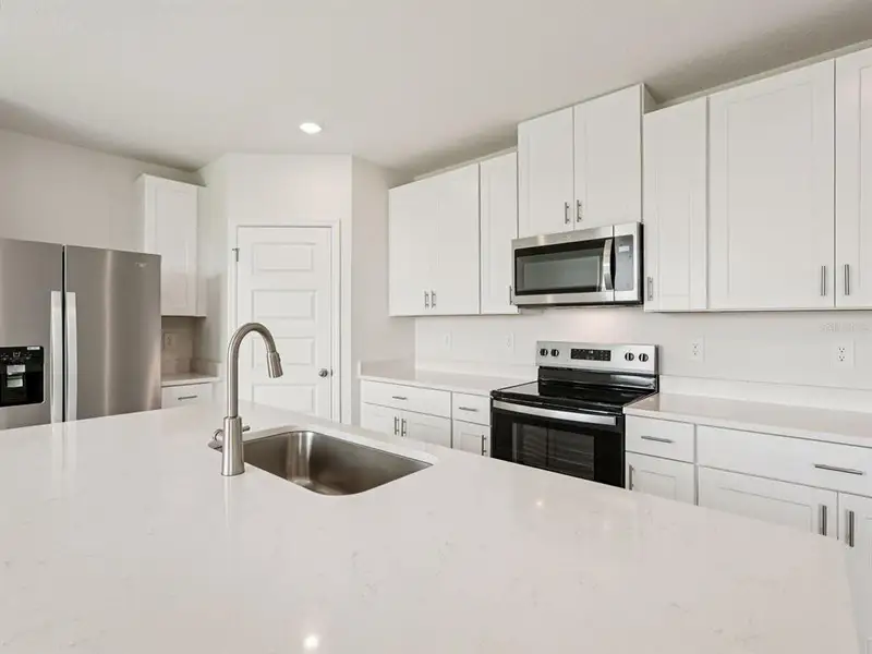 Furnished interior view inside a new home in Two Rivers - Premier Series, Zephyrhills (Image 3). Furnished interior view inside a new home in Two Rivers - Premier Series, Zephyrhills (Image 3).