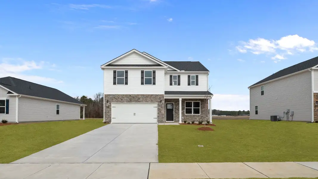 Front exterior of a new home in East Ridge, Ayden, NC, highlighting curb appeal (Image 2). Front exterior of a new home in East Ridge, Ayden, NC, highlighting curb appeal (Image 2).
