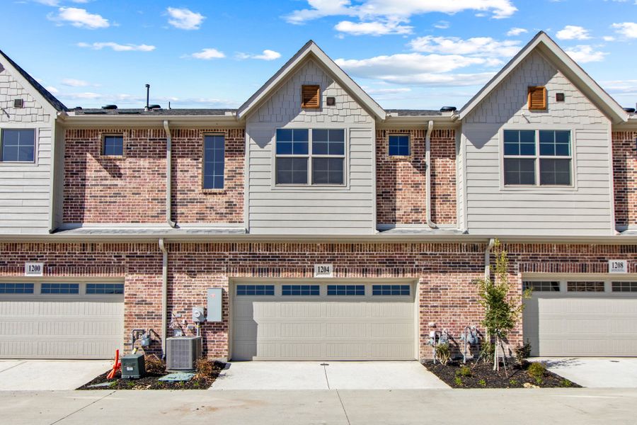 Front exterior of a new home in The Tribute, The Colony, TX, highlighting curb appeal (Image 25).