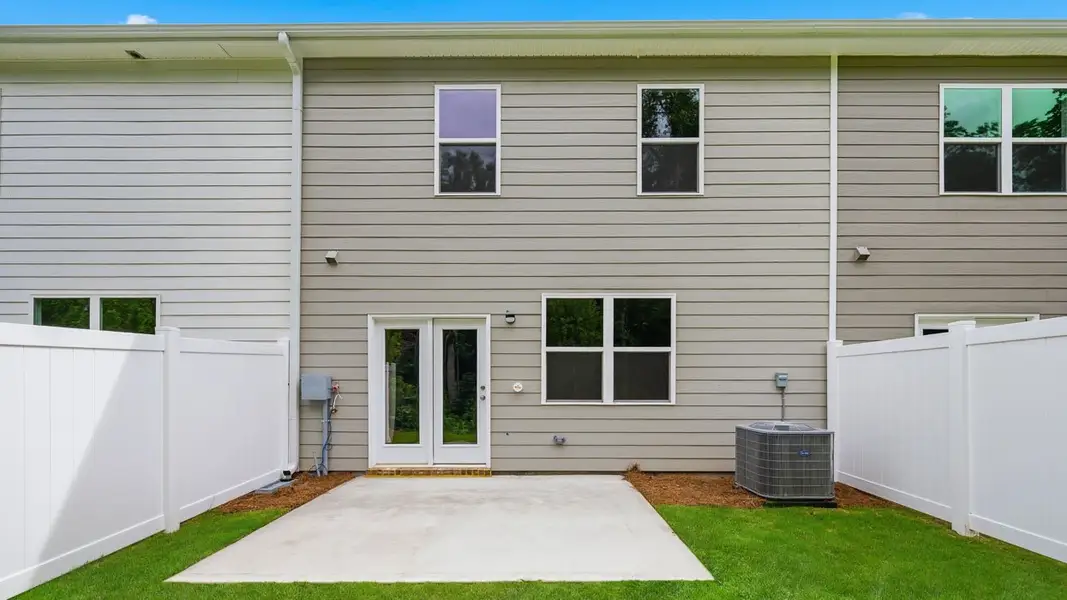 Exterior details and patio area of a home in Independence Villas and Townhomes, Loganville (Image 4).
