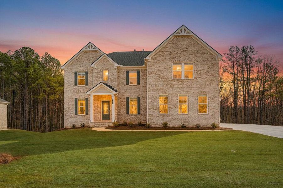 Front exterior of a new home in Trinity Park, McDonough, GA, highlighting curb appeal (Image 2). Front exterior of a new home in Trinity Park, McDonough, GA, highlighting curb appeal (Image 2).