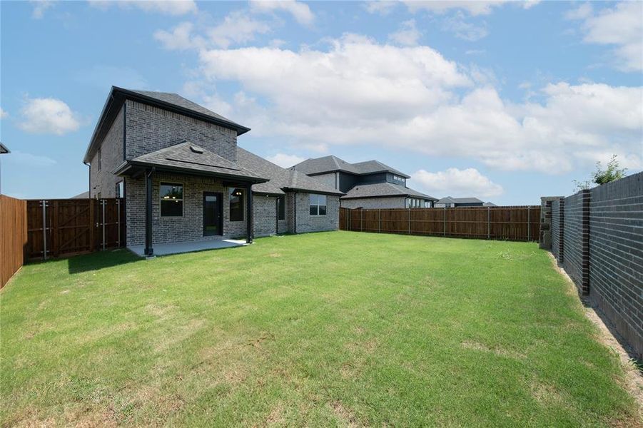 Front exterior of a new home in Valencia on the Lake: Valencia 50s, Little Elm, TX, highlighting curb appeal (Image 1). Front exterior of a new home in Valencia on the Lake: Valencia 50s, Little Elm, TX, highlighting curb appeal (Image 1).