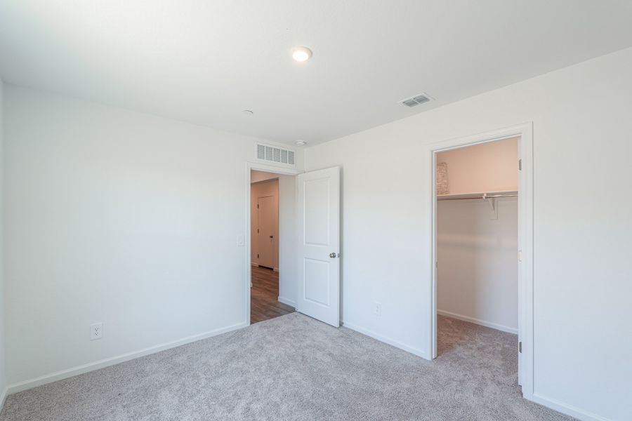 A hallway with white doors. A hallway with white doors.
