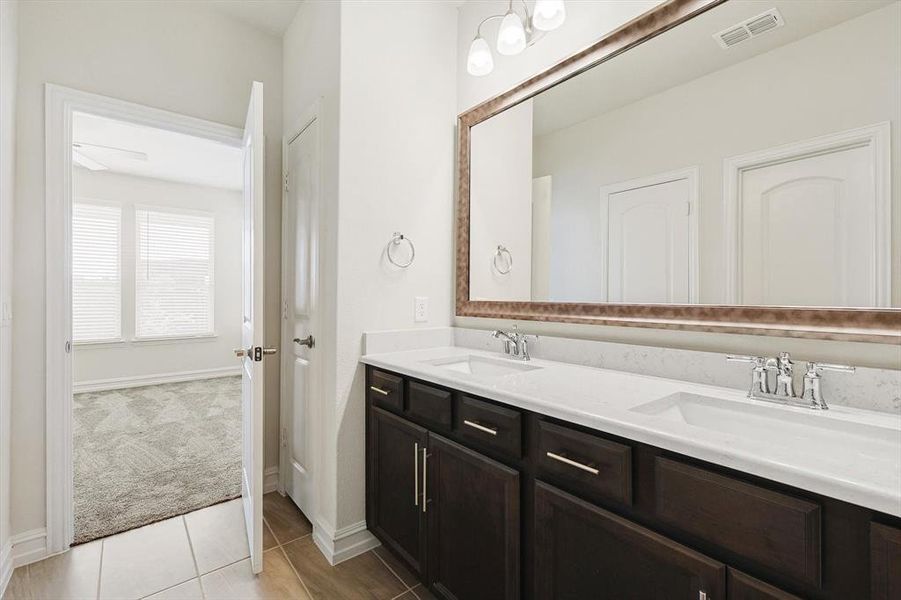 Bathroom with vanity and tile patterned floors