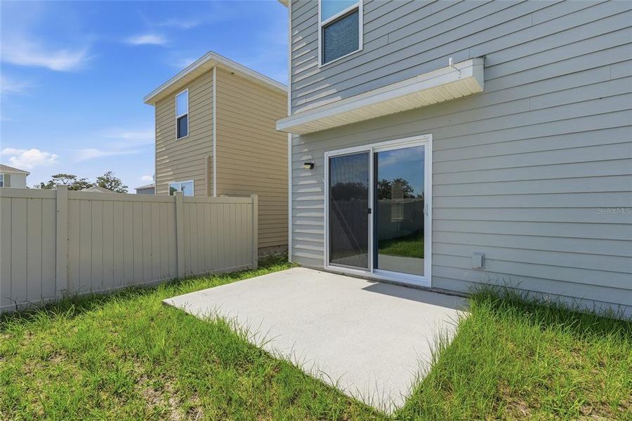 Exterior details and patio area of a home in Avalon Woods, Newberry (Image 3).
