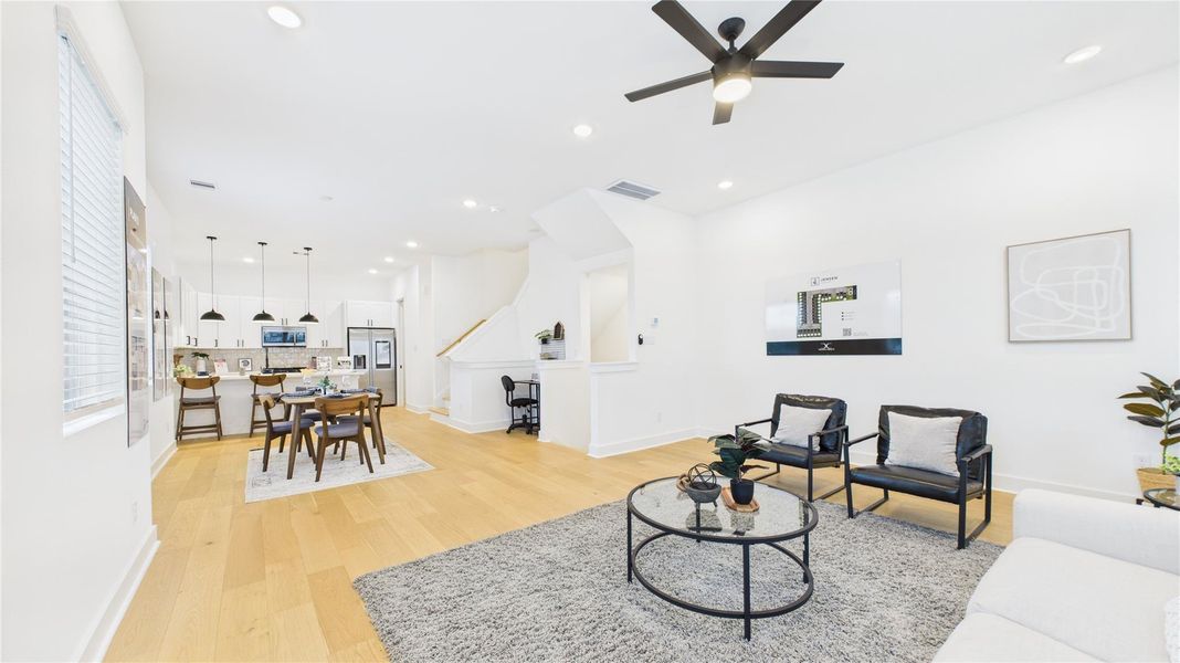 With seamless transitions between the living, dining, and kitchen areas, this space fosters effortless entertaining and everyday comfort. High ceilings, elegant finishes, and a spacious feel make this area a true centerpiece of the home, perfect for gatherings or quiet relaxation. With seamless transitions between the living, dining, and kitchen areas, this space fosters effortless entertaining and everyday comfort. High ceilings, elegant finishes, and a spacious feel make this area a true centerpiece of the home, perfect for gatherings or quiet relaxation.